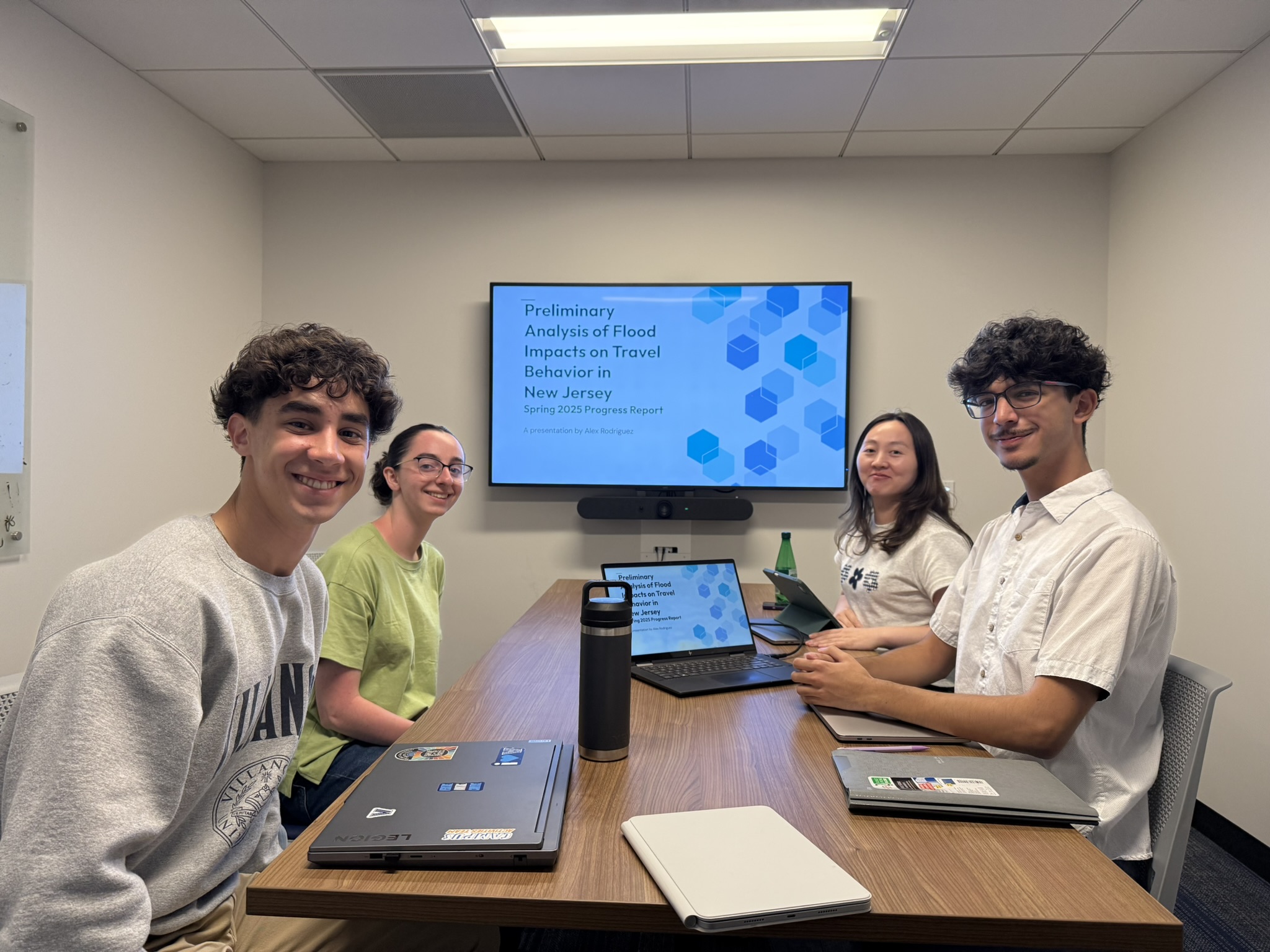 Undergraduate student research team presenting flood impact analysis